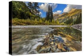 Mcdonald Creek with the Garden Wall in Glacier National Park, Montana, Usa-Chuck Haney-Stretched Canvas