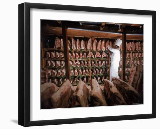 Meat Industry in the USA, Rib Roasts on Shelves and Butcher Making a Selection or Choice-Ralph Crane-Framed Photographic Print