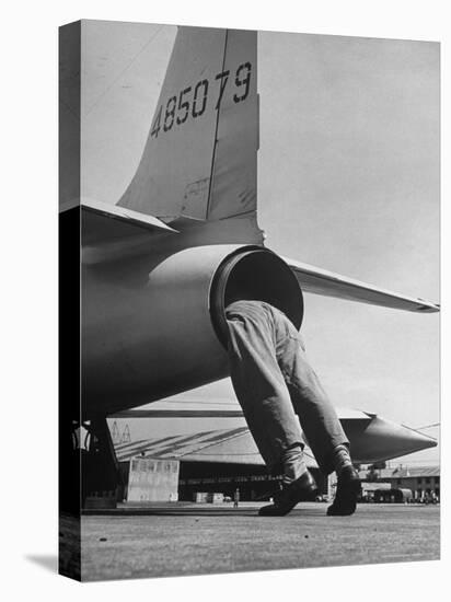 Mechanic Climbing Into Tailpipe to Check Clearance Between Turbine Wheel Bucket Tips and rug-Charles E^ Steinheimer-Stretched Canvas