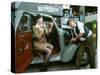 Mechanic with lady driver doing her make up, 1930s Hillman Minx-null-Stretched Canvas