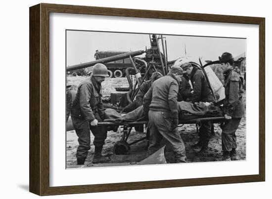 Medics Carry a Wounded U.S. Soldier Away from a Rescue Helicopter-null-Framed Photo