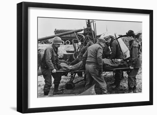 Medics Carry a Wounded U.S. Soldier Away from a Rescue Helicopter-null-Framed Photo