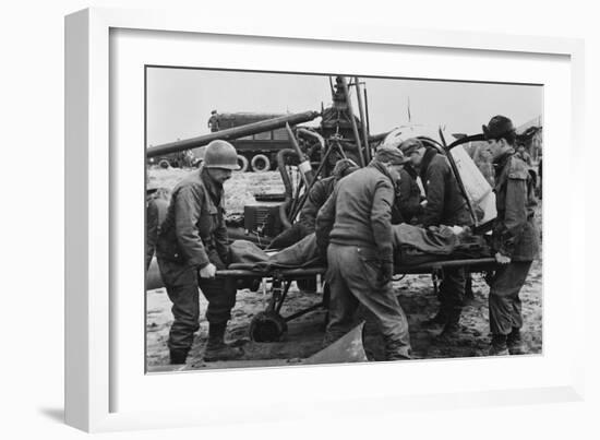 Medics Carry a Wounded U.S. Soldier Away from a Rescue Helicopter-null-Framed Photo