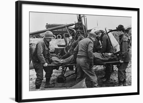 Medics Carry a Wounded U.S. Soldier Away from a Rescue Helicopter-null-Framed Photo