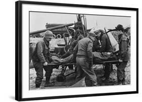 Medics Carry a Wounded U.S. Soldier Away from a Rescue Helicopter-null-Framed Photo