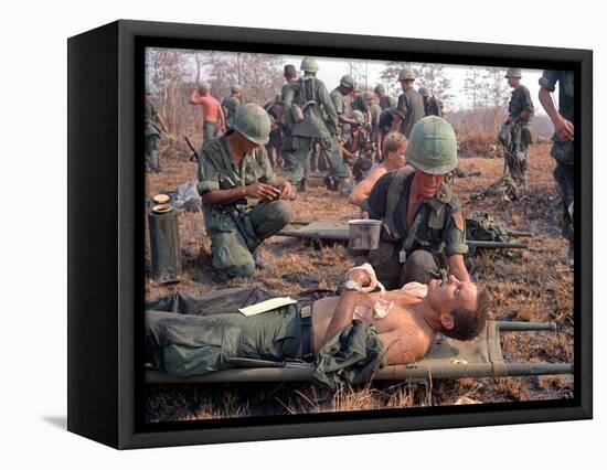 Medics Treat Wounded-Associated Press-Framed Stretched Canvas
