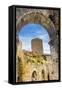 Medieval stone arch and tower, San Gimignano, Tuscany, Italy.-William Perry-Framed Stretched Canvas