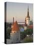 Medieval Town Walls and Spire of St. Olav's Church at Dusk, Tallinn, Estonia, Baltic States-Neale Clarke-Stretched Canvas