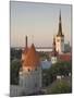 Medieval Town Walls and Spire of St. Olav's Church at Dusk, Tallinn, Estonia, Baltic States-Neale Clarke-Mounted Photographic Print