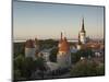 Medieval Town Walls and Spire of St. Olavs Church at Dusk, Tallinn, Estonia, Baltic States, Europe-Neale Clarke-Mounted Photographic Print