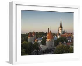 Medieval Town Walls and Spire of St. Olavs Church at Dusk, Tallinn, Estonia, Baltic States, Europe-Neale Clarke-Framed Photographic Print