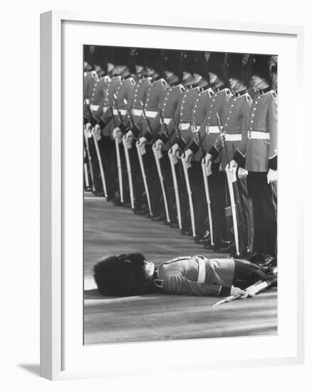 Member of Honor Guard Lying on the Ground After Fainting During Ceremonies For Queen Elizabeth-John Loengard-Framed Photographic Print