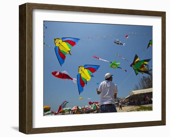 Member of Indonesia Kite Team Flies Kite with Series of Colorful Bird Sales, Vung Tau City, Vietnam-null-Framed Photographic Print
