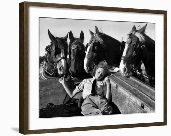 Member of the Women's Land Army a Sleep in the Back of a Hay Cart While the Horses Look On-null-Framed Photographic Print