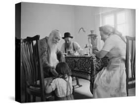 Members of a Jewish Family Sitting Down For a Meal-Paul Schutzer-Stretched Canvas