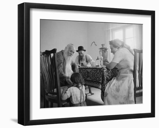 Members of a Jewish Family Sitting Down For a Meal-Paul Schutzer-Framed Photographic Print