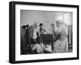 Members of a Jewish Family Sitting Down For a Meal-Paul Schutzer-Framed Photographic Print