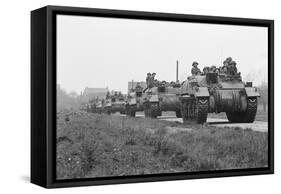 Members of the British 49th Armoured Personnel Carrier Regiment Riding Along a Line of Tanks-George Silk-Framed Stretched Canvas
