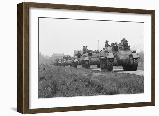 Members of the British 49th Armoured Personnel Carrier Regiment Riding Along a Line of Tanks-George Silk-Framed Photographic Print