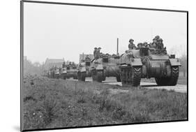 Members of the British 49th Armoured Personnel Carrier Regiment Riding Along a Line of Tanks-George Silk-Mounted Photographic Print