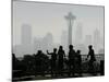 Members of the Cascade Bike Club Pause and Take in a Foggy View of the Space Needle-Ted S. Warren-Mounted Photographic Print