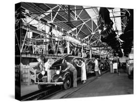 Men and Women Polishing Chevrolets on the Assembly Line at the General Motors Plant-null-Stretched Canvas