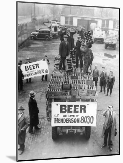 Men Atop Beer Delivery Truck Hoist Cases of Beer Triumphantly While Man Repeal of Prohibition-null-Mounted Photographic Print