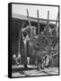 Men Constructing a Wheat Wreath Behind a Wheat Filled Wagon During the Harvest Season-Hans Wild-Framed Stretched Canvas