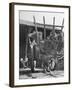 Men Constructing a Wheat Wreath Behind a Wheat Filled Wagon During the Harvest Season-Hans Wild-Framed Photographic Print