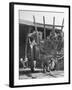 Men Constructing a Wheat Wreath Behind a Wheat Filled Wagon During the Harvest Season-Hans Wild-Framed Photographic Print