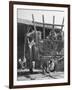 Men Constructing a Wheat Wreath Behind a Wheat Filled Wagon During the Harvest Season-Hans Wild-Framed Photographic Print