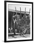 Men Constructing a Wheat Wreath Behind a Wheat Filled Wagon During the Harvest Season-Hans Wild-Framed Photographic Print