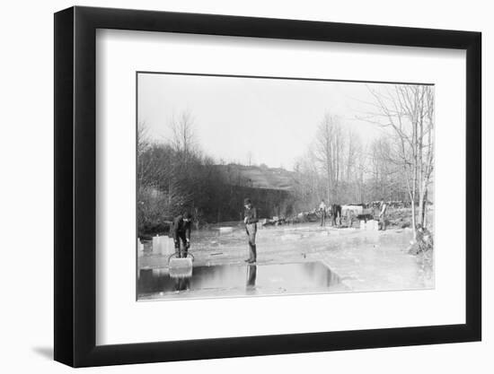 Men Cutting Ice from Frozen Pond-null-Framed Photographic Print