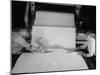 Men Cutting Sheet of Newly Manufactured Rubber-null-Mounted Photographic Print