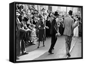 Men dancing in the street as revelers celebrate New Orleans Mardi Gras. February 1938-William Vandivert-Framed Stretched Canvas