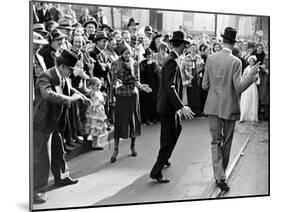 Men dancing in the street as revelers celebrate New Orleans Mardi Gras. February 1938-William Vandivert-Mounted Premium Photographic Print