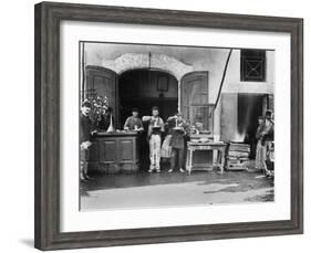 Men Eating Long Spaghetti at a Street Food Shop in Naples, Italy, Ca. 1900-null-Framed Photo