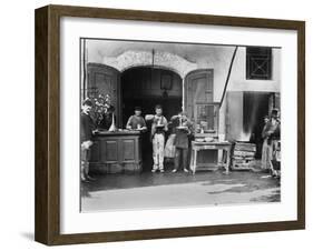 Men Eating Long Spaghetti at a Street Food Shop in Naples, Italy, Ca. 1900-null-Framed Photo