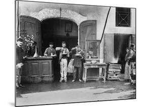 Men Eating Long Spaghetti at a Street Food Shop in Naples, Italy, Ca. 1900-null-Mounted Photo