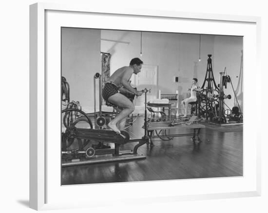 Men Exercising in Gymnasium at Homestead Hotel-John Phillips-Framed Premium Photographic Print