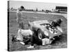 Men Fixing Their Race Car During the Grand Prix-Stan Wayman-Stretched Canvas