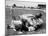 Men Fixing Their Race Car During the Grand Prix-Stan Wayman-Mounted Photographic Print