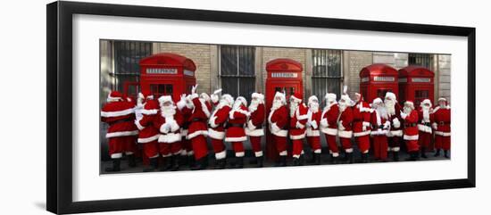 Men from the London Santa School, Dressed in Christmas Outfits, Pose by Telephone Boxes in London-null-Framed Photographic Print