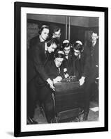 Men Huddled Around Telegraph Transmitter During Training by Federal Vocational Board-null-Framed Photographic Print