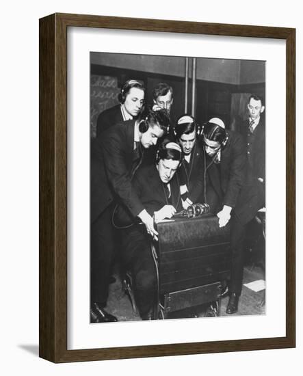 Men Huddled Around Telegraph Transmitter During Training by Federal Vocational Board-null-Framed Photographic Print