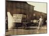 Men in Front of a Wells Fargo and Co Express Depot with Crates and Milk Cans, Missouri, 1916-Lewis Wickes Hine-Mounted Photographic Print