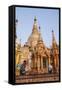 Men Laying Out Oil Lamps for Evening Ceremony at Buddhist Temple-Stephen Studd-Framed Stretched Canvas