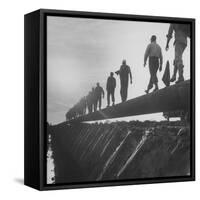 Men Laying Pipeline-null-Framed Stretched Canvas