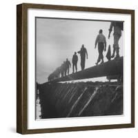 Men Laying Pipeline-null-Framed Photographic Print