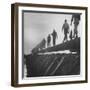 Men Laying Pipeline-null-Framed Photographic Print